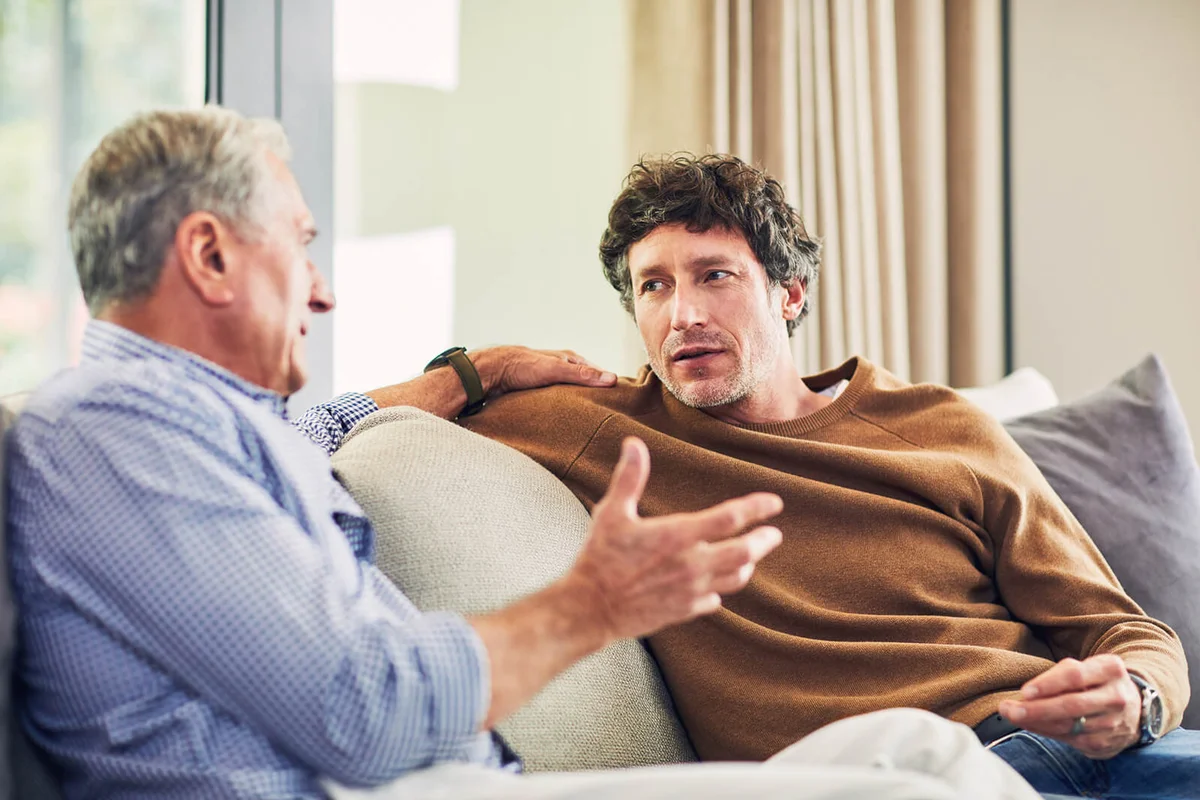 two men having serious conversation