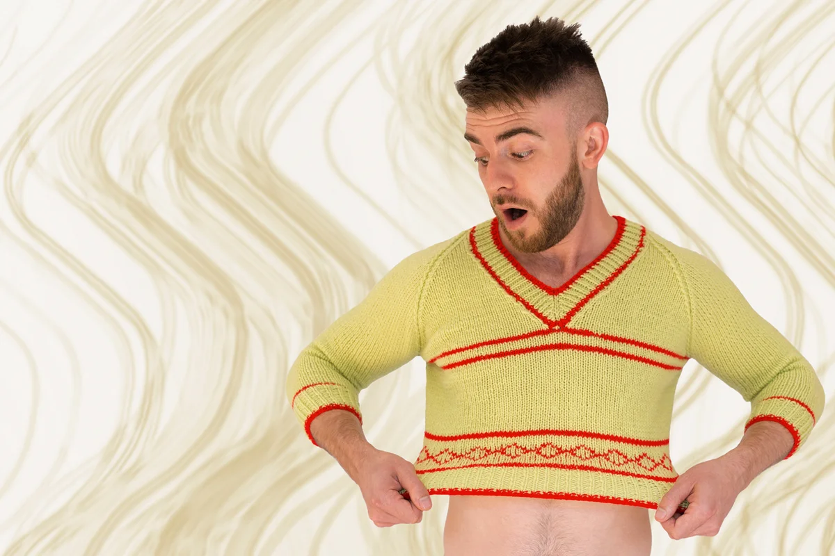 Man realising his jumper has shrunk