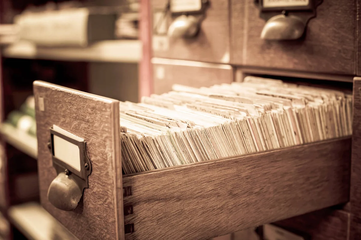 Antique wooden storage boxes in an Archive