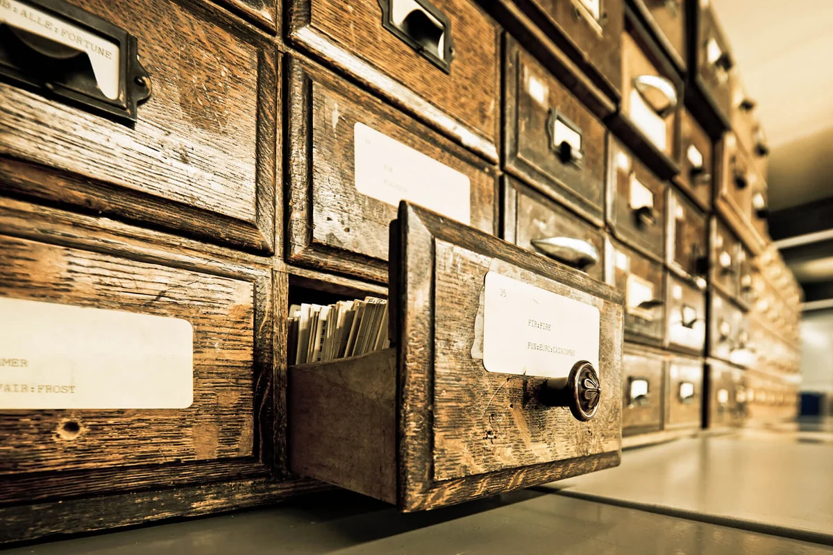 Antique wooden storage boxes in an Archive