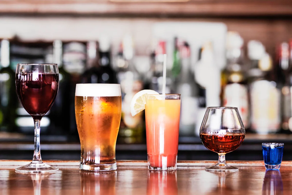 Row of assorted drinks in a bar