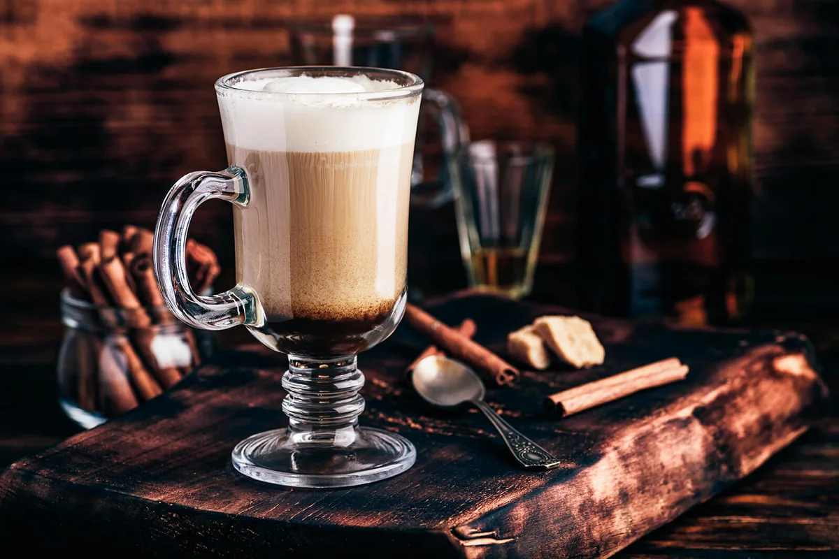 Irish coffee in drinking glass