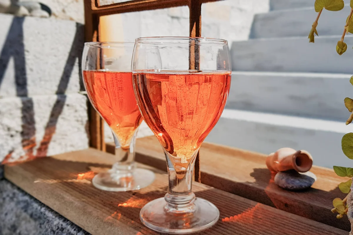 Two Drinks Of Aperol Standing At The Window