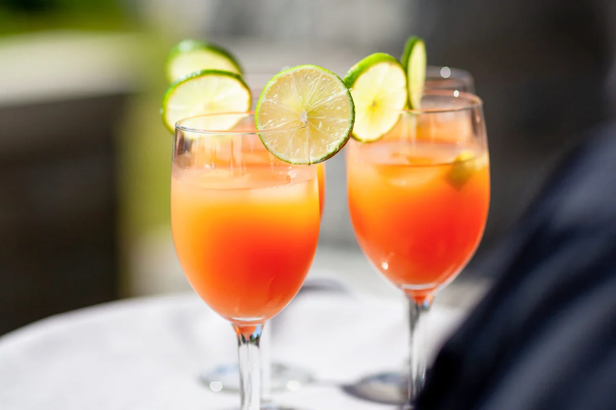 Colorful fruit cocktails on server tray