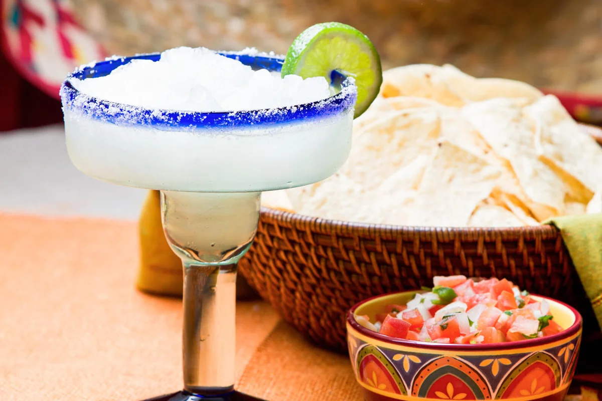 Salsa and Margarita on a table with Mexican decor