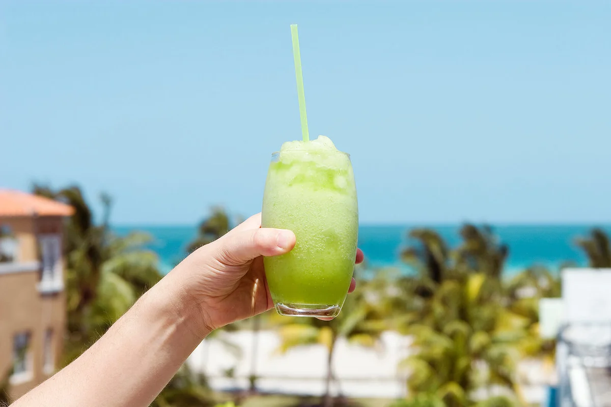 Hand holding a frozen Mojito