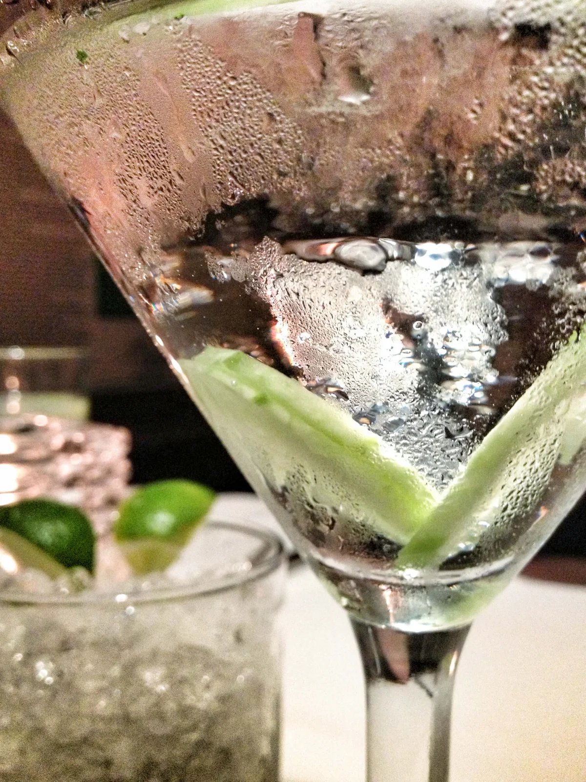 classic martini in marine glass with cucumber slices