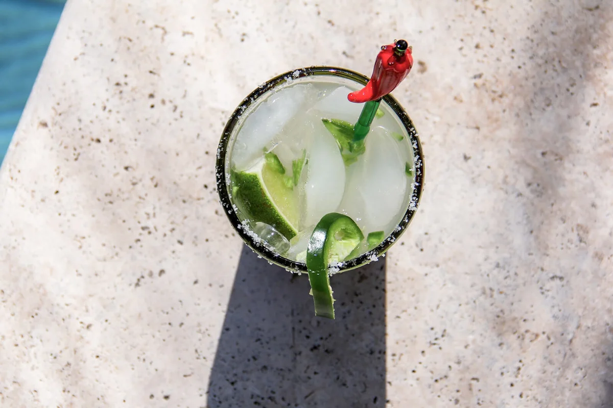 cocktail on the edge of a swimming pool