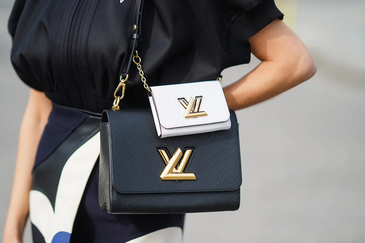 Xenia Adonts wears double Vuitton black and white bags | Getty Editorial Use