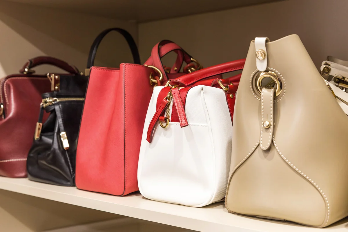 Handbags stored in woman's closet