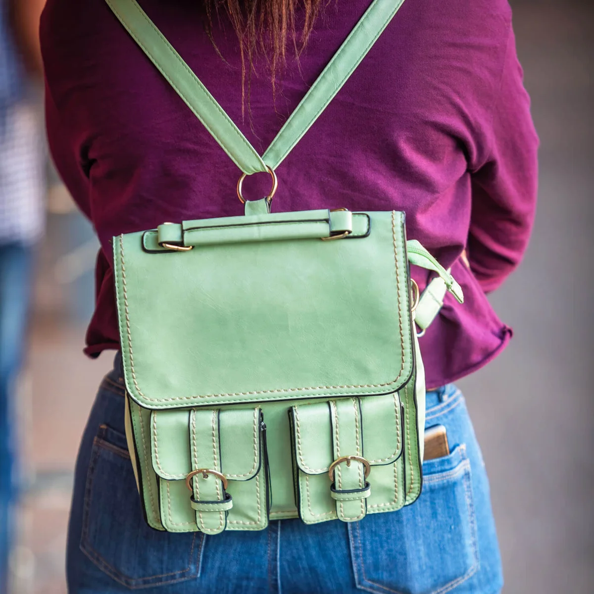 woman with a green bag