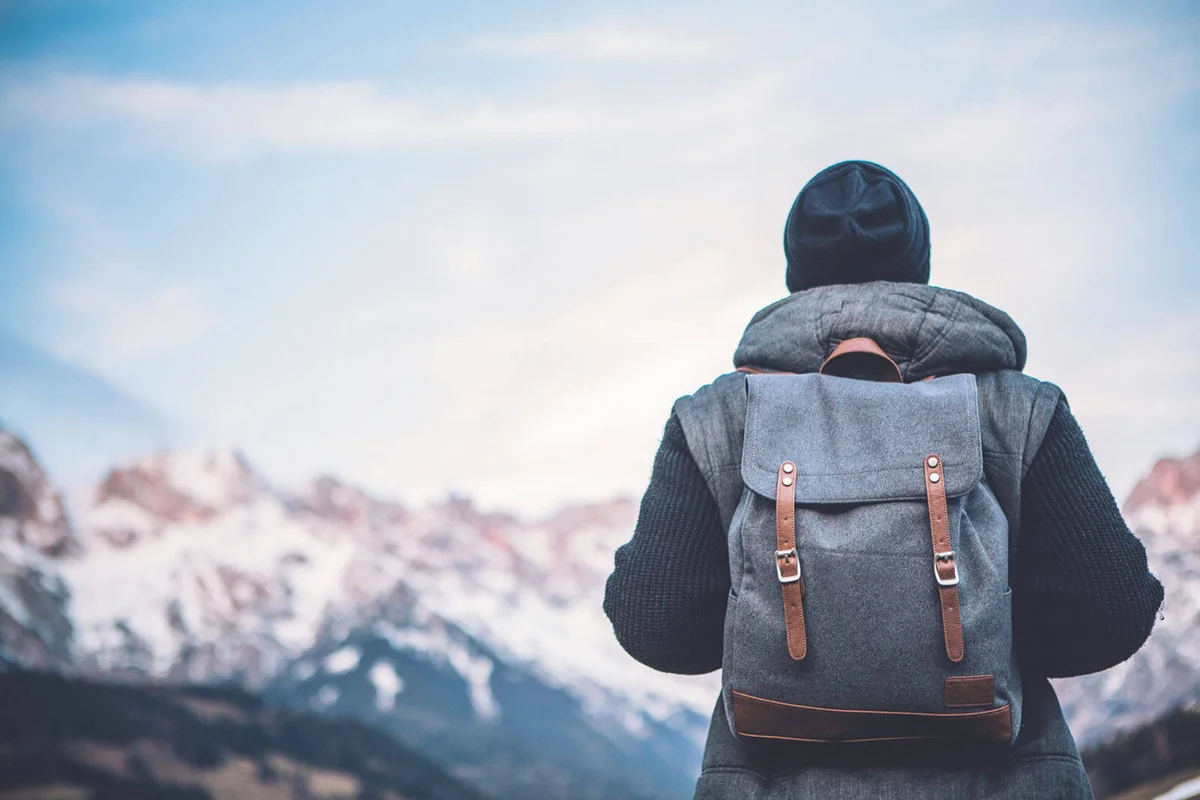man on vacation hiking in Austrian Alps