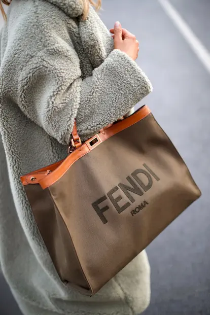 Woman carrying shopper by Fendi