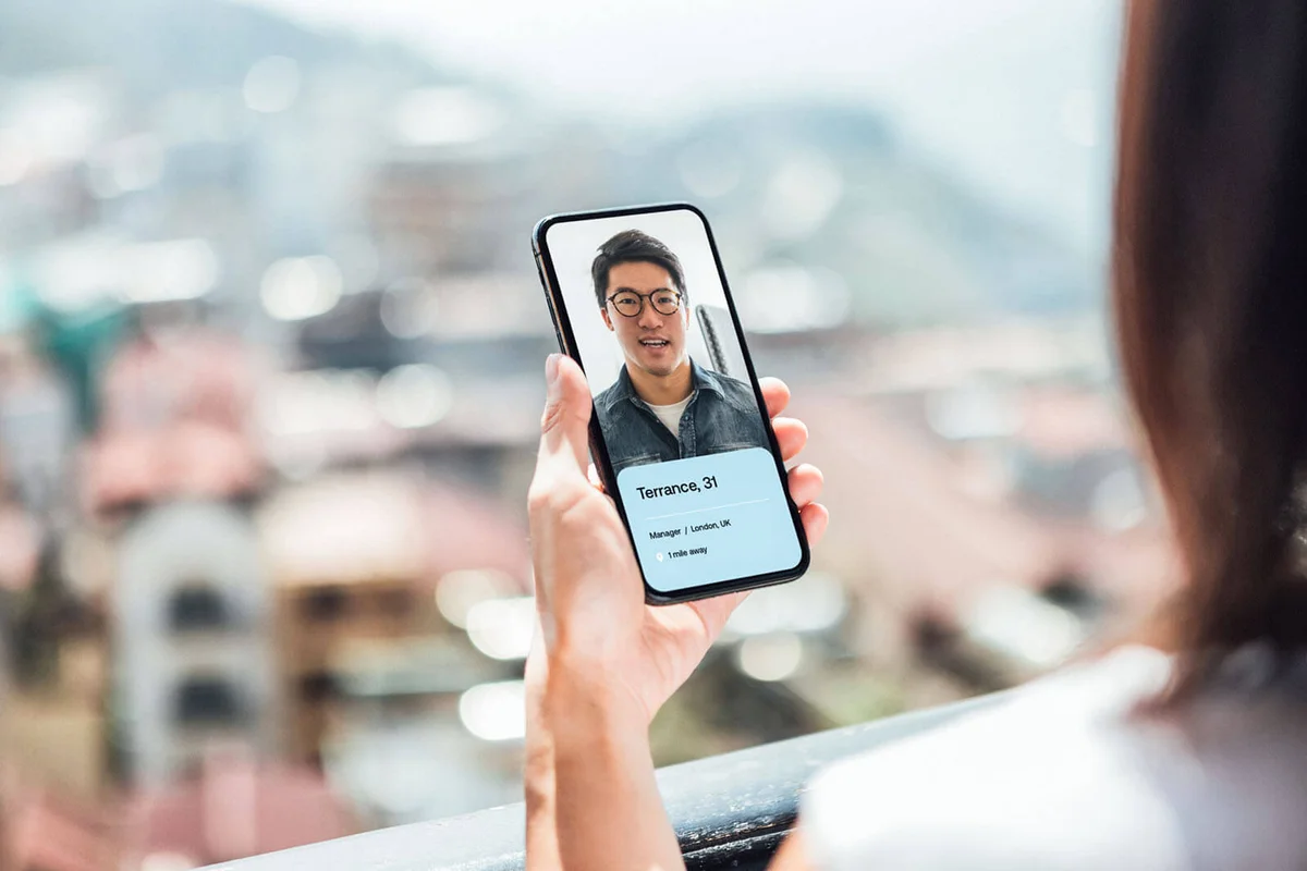 Young Woman Using Dating App On Smart Phone