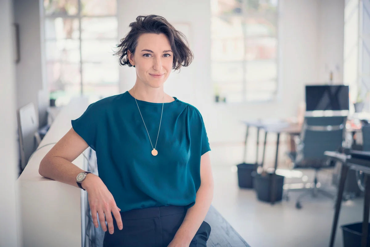 Smiling businesswoman in creative office