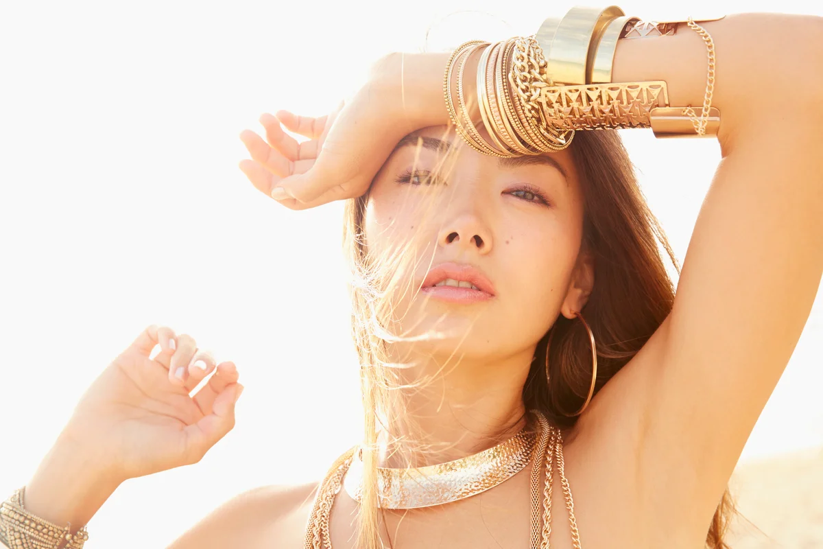 Woman wearing gold bracelets