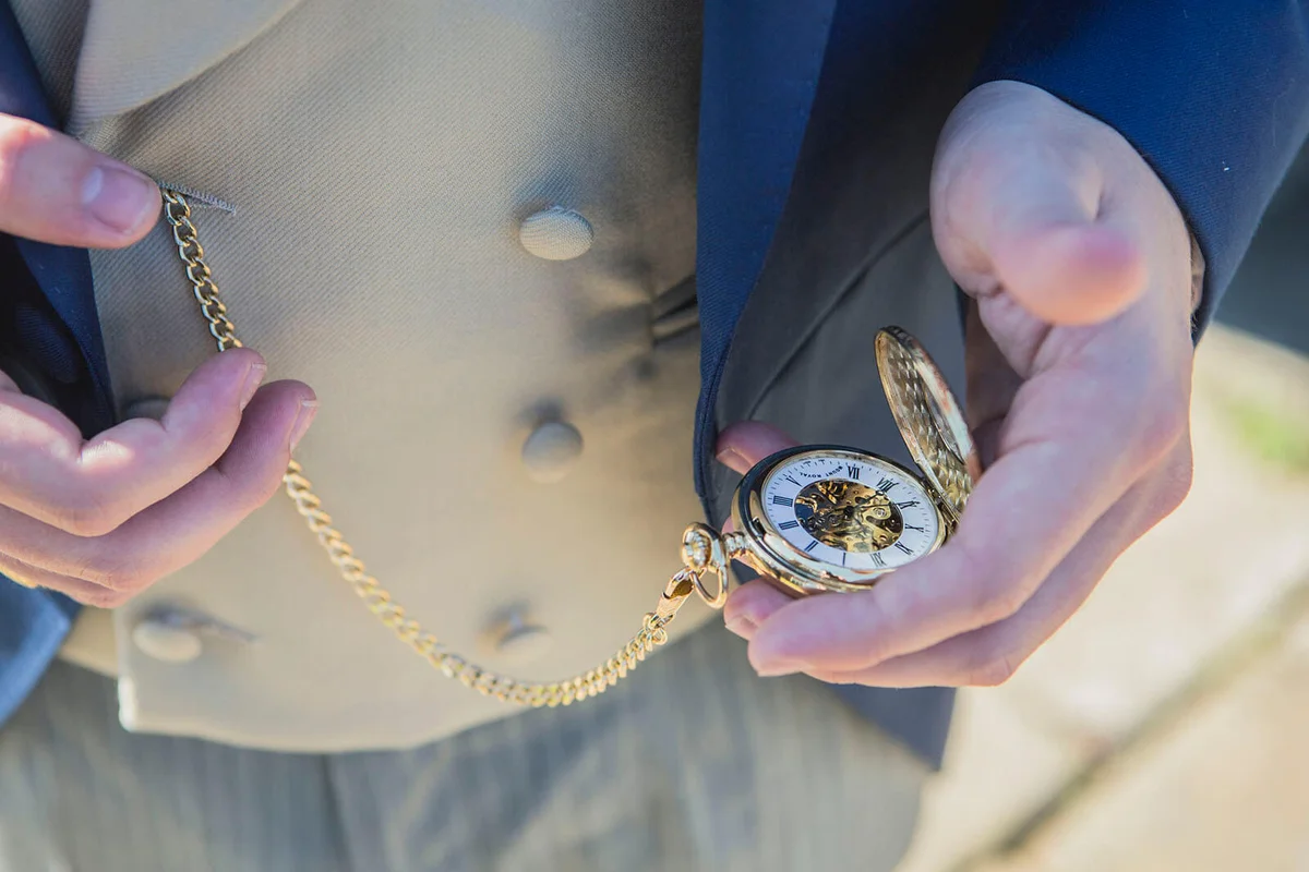Midsection Of Man Holding Pocket Watch