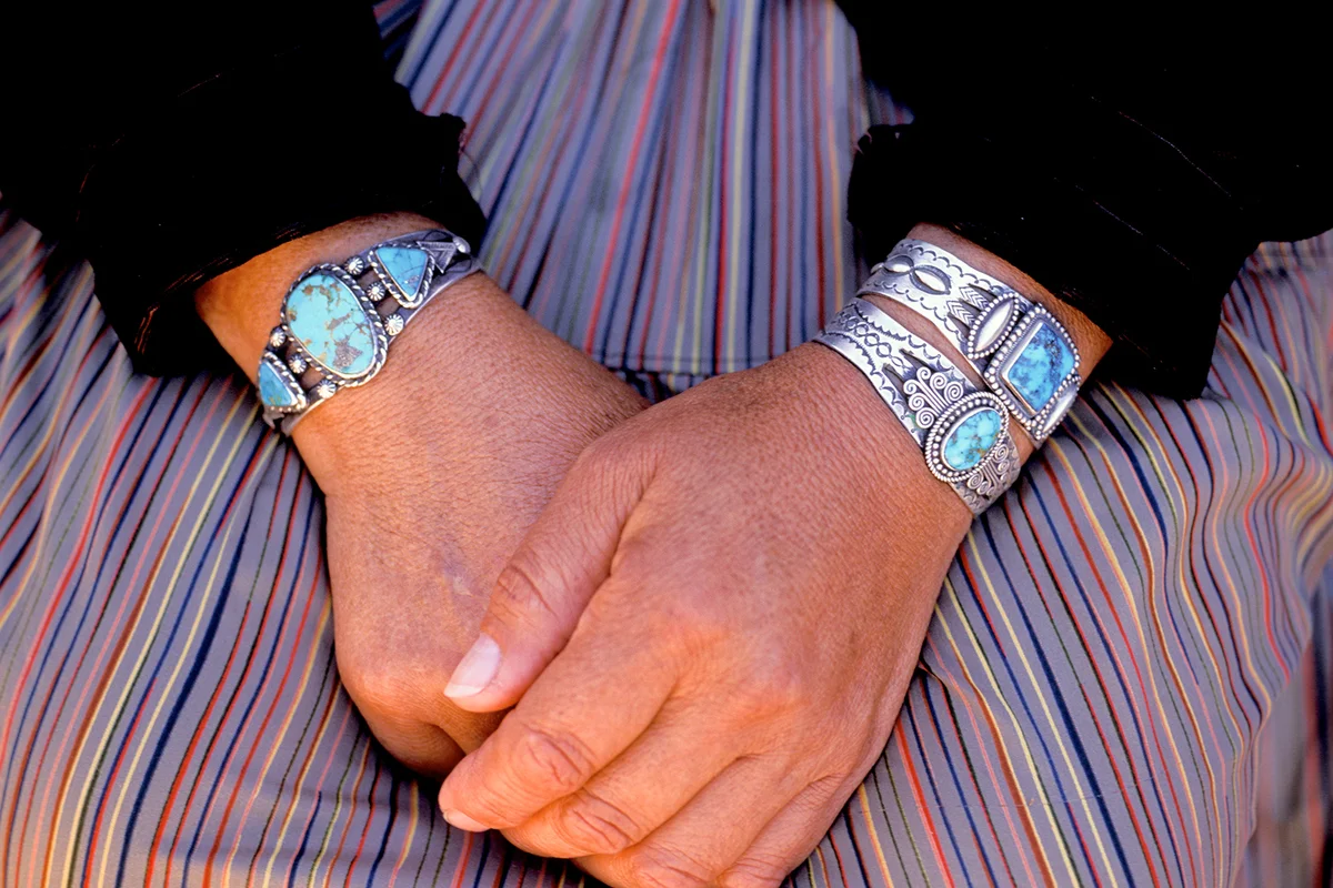Close Up Of Hands With Turquoise & Silver Bracelets/ Getty Editorial Use