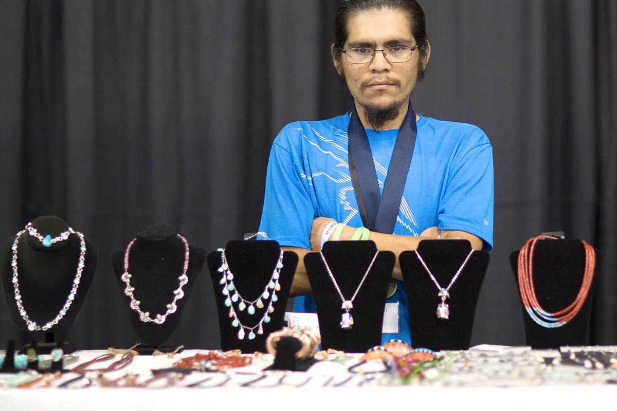 Clifton Aguilar displays his hand made jewelry / Getty Editorial Use