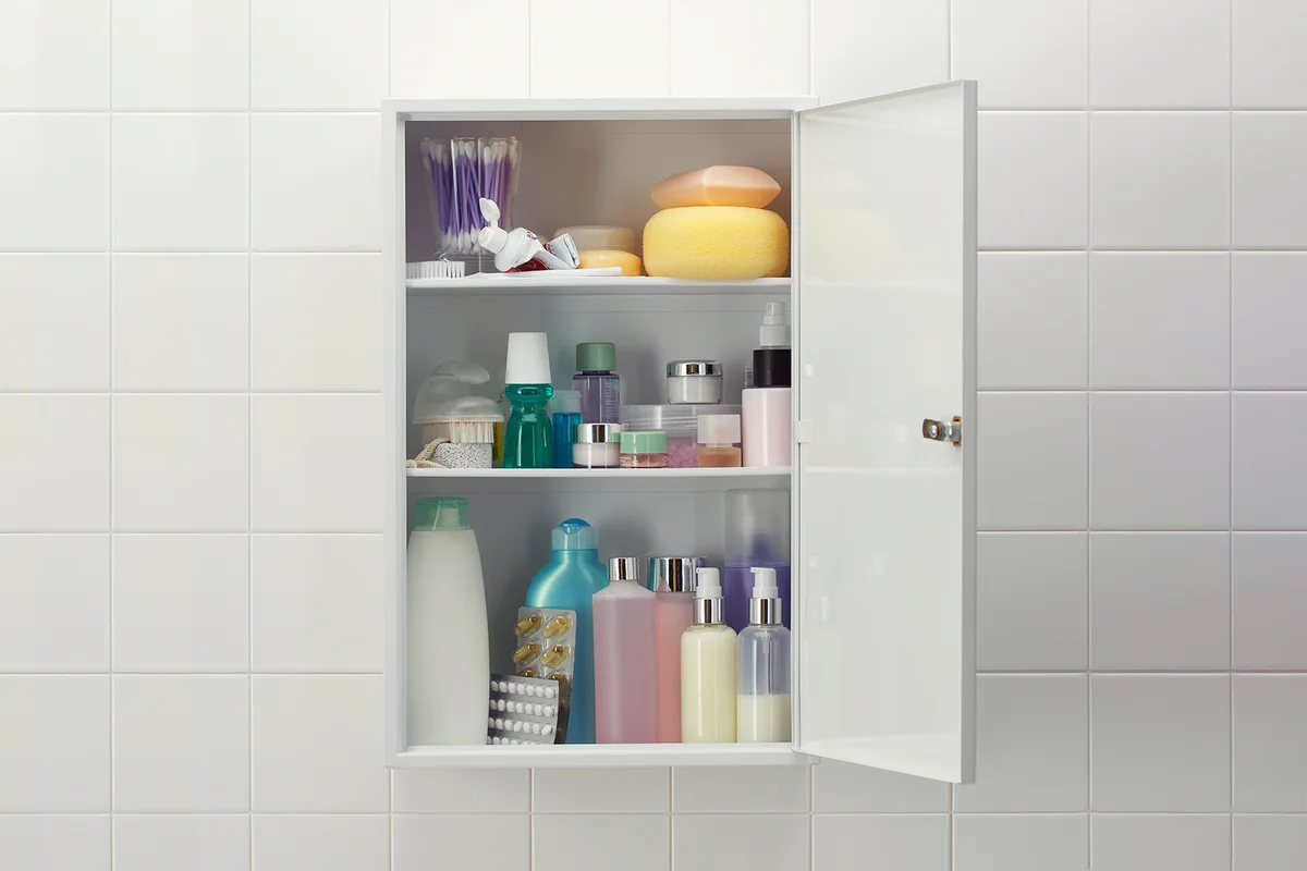 Various cosmetics and bath products in medicine cabinet