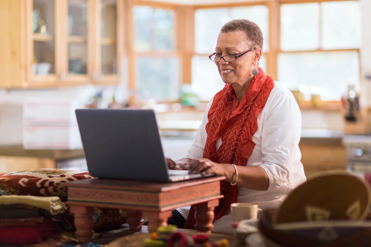 Senior using laptop