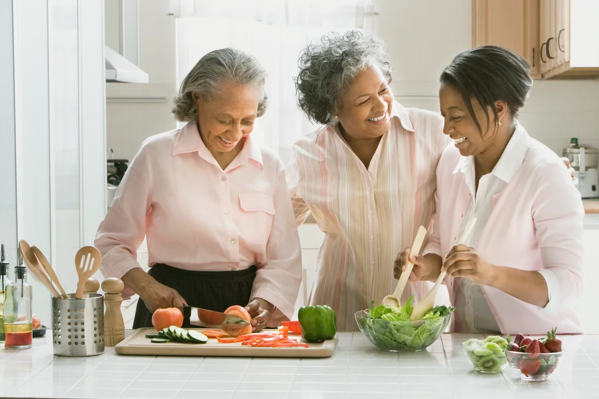 Women preparing food in kitchen