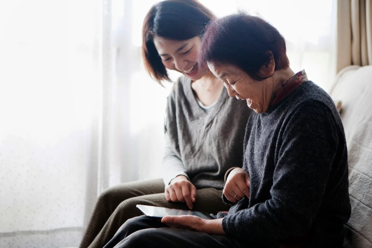 Family watching a digital tablet together