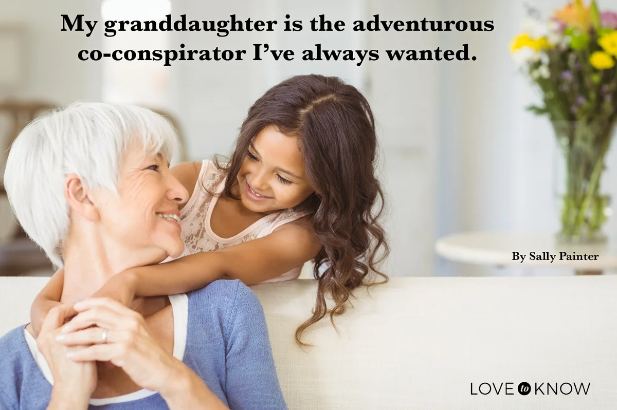 Granddaughter hugging her grandmother in living room
