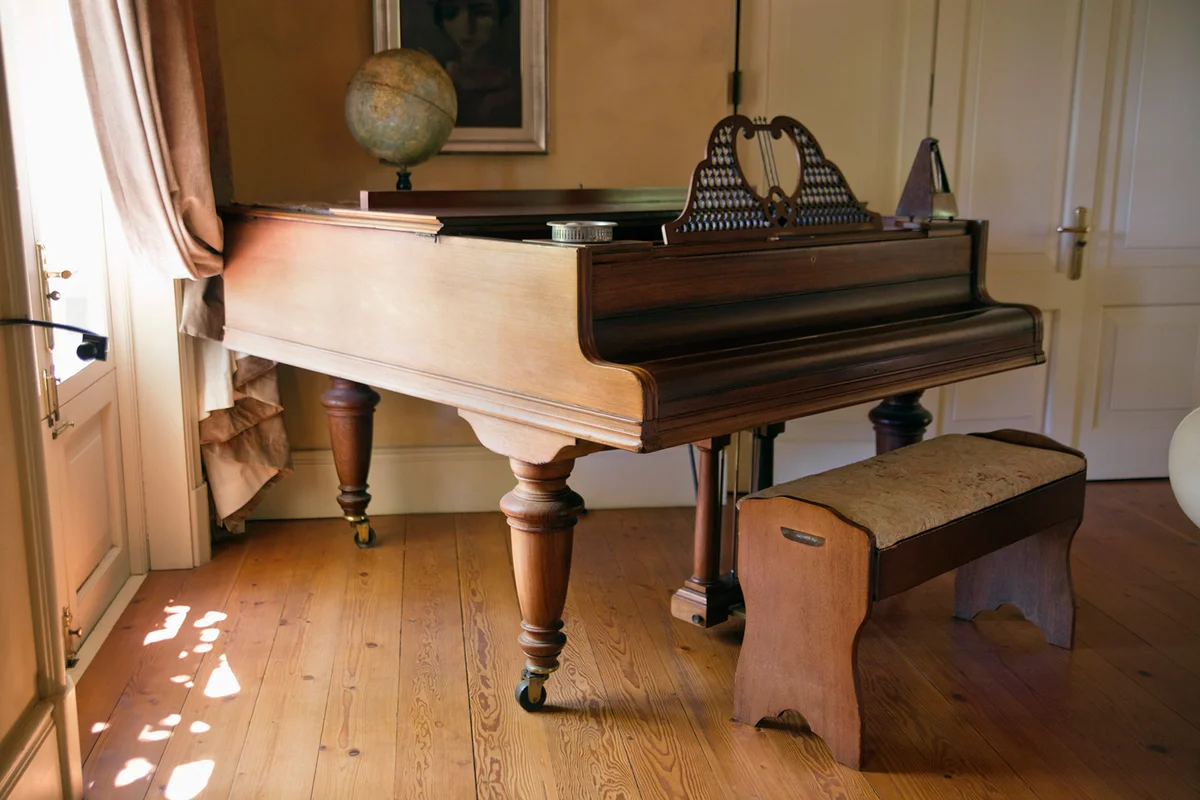 View of piano in living room