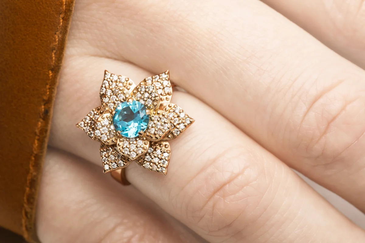 Beautiful golden ring with blue zircon gem