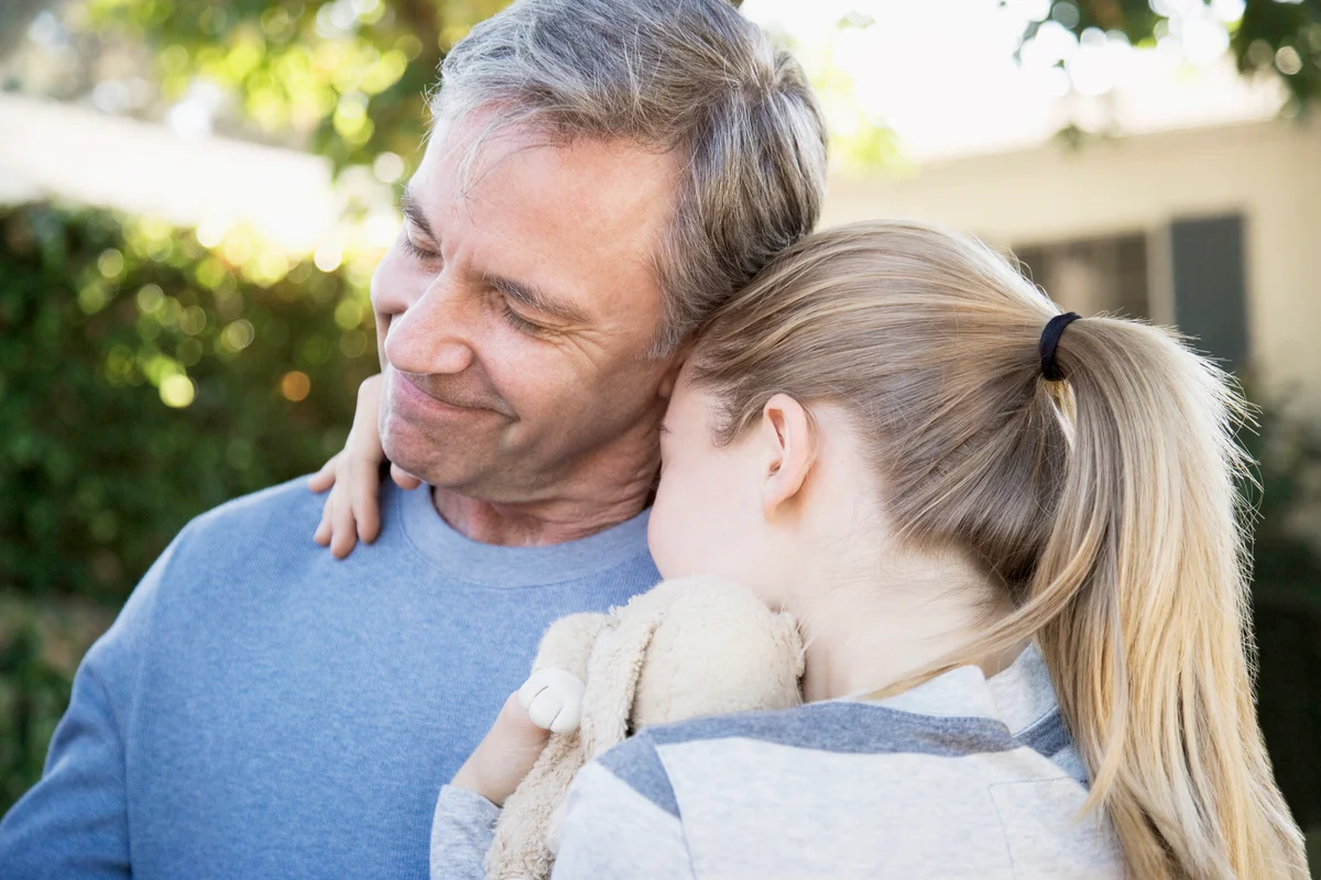 Step-dad and Daughter Hugging