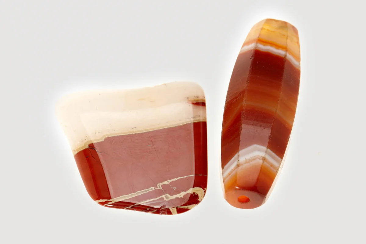 Two red stones on white