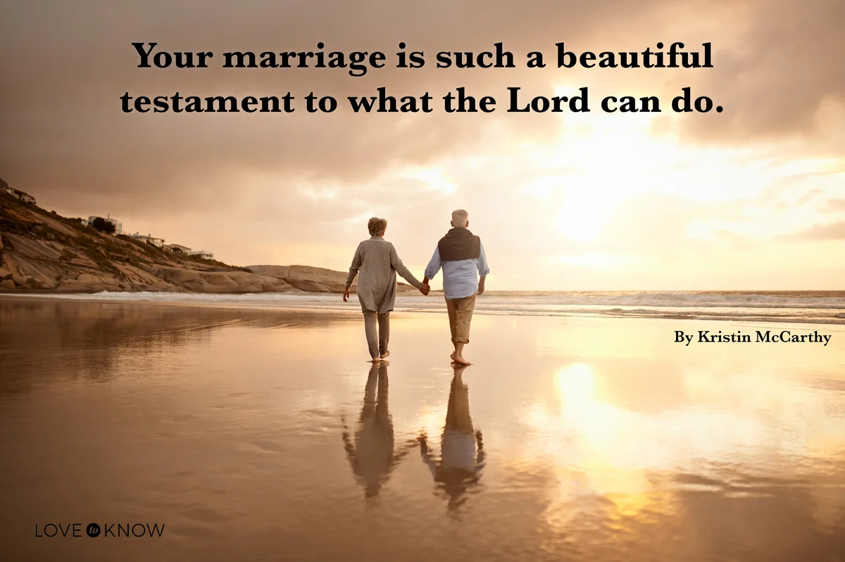 Happy senior couple going for a walk on the beach