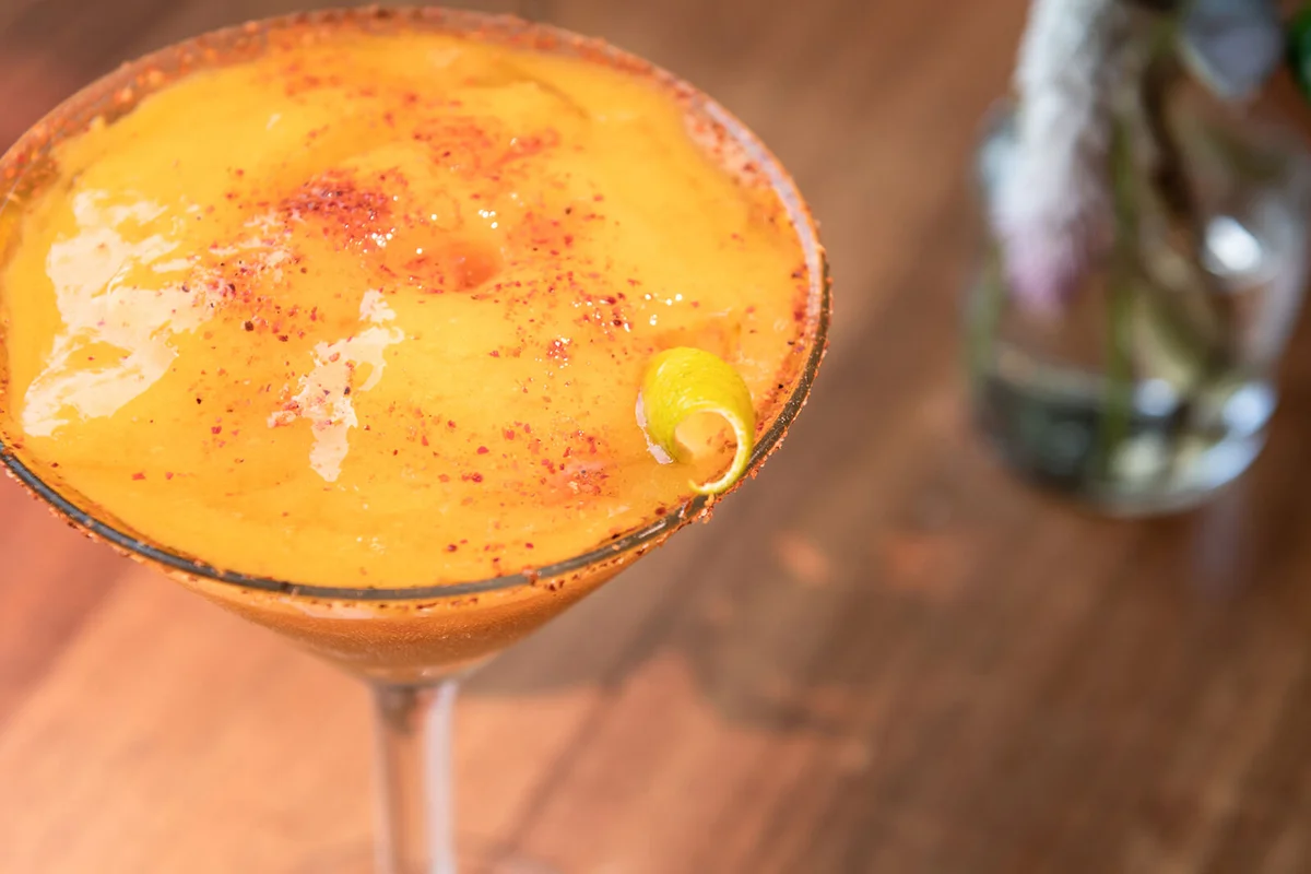 Mango margarita frappe on wooden table