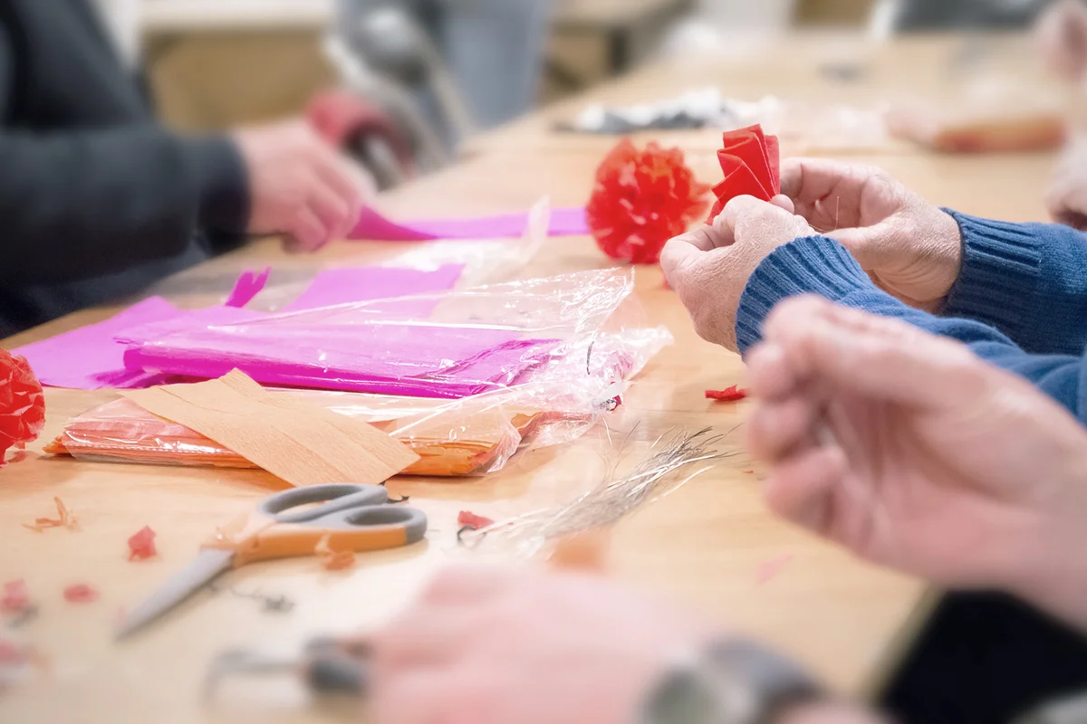 Seniors manufacture crepe paper decorations