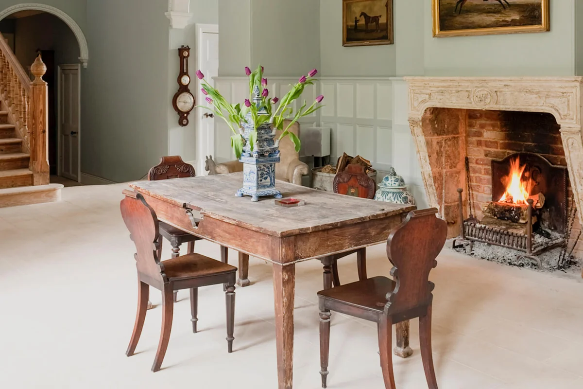 White painted panelled reception room of Gloucestershire country estate