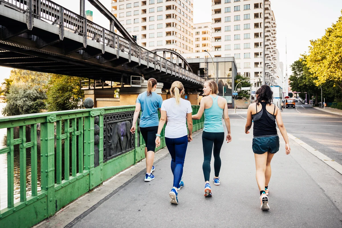 Fitness Group Cooling Down After City Run