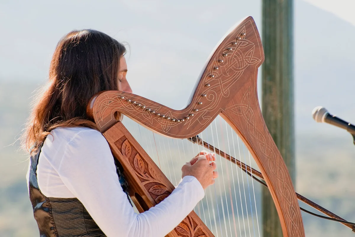 Young Woman playing a harp