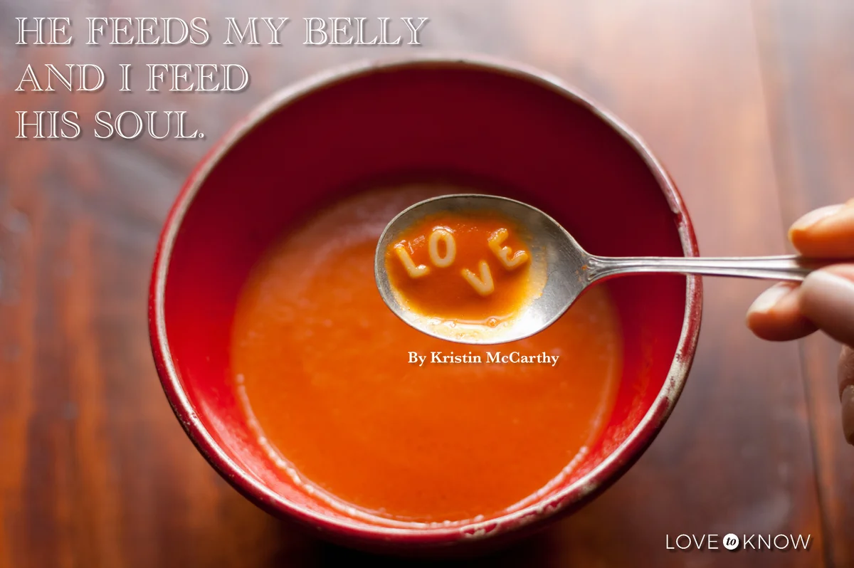 Woman holding spoonful of soup with letters LOVE