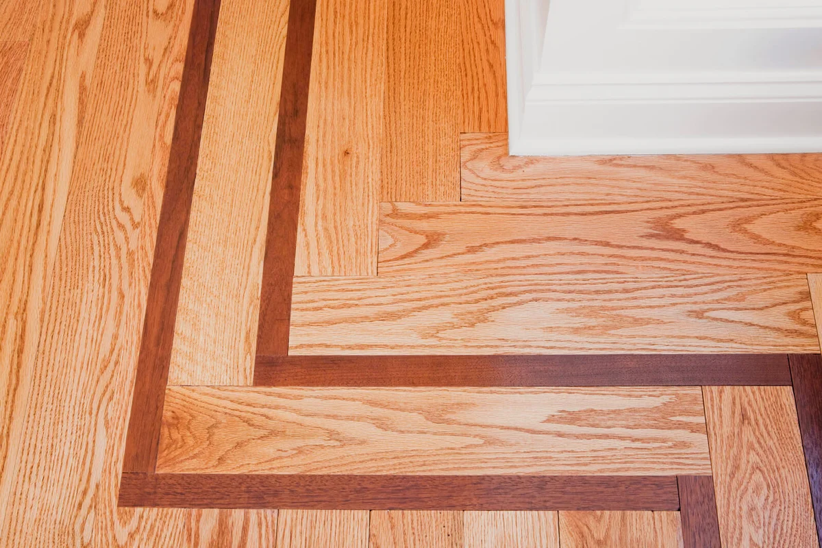 Baseboard and wooden floor