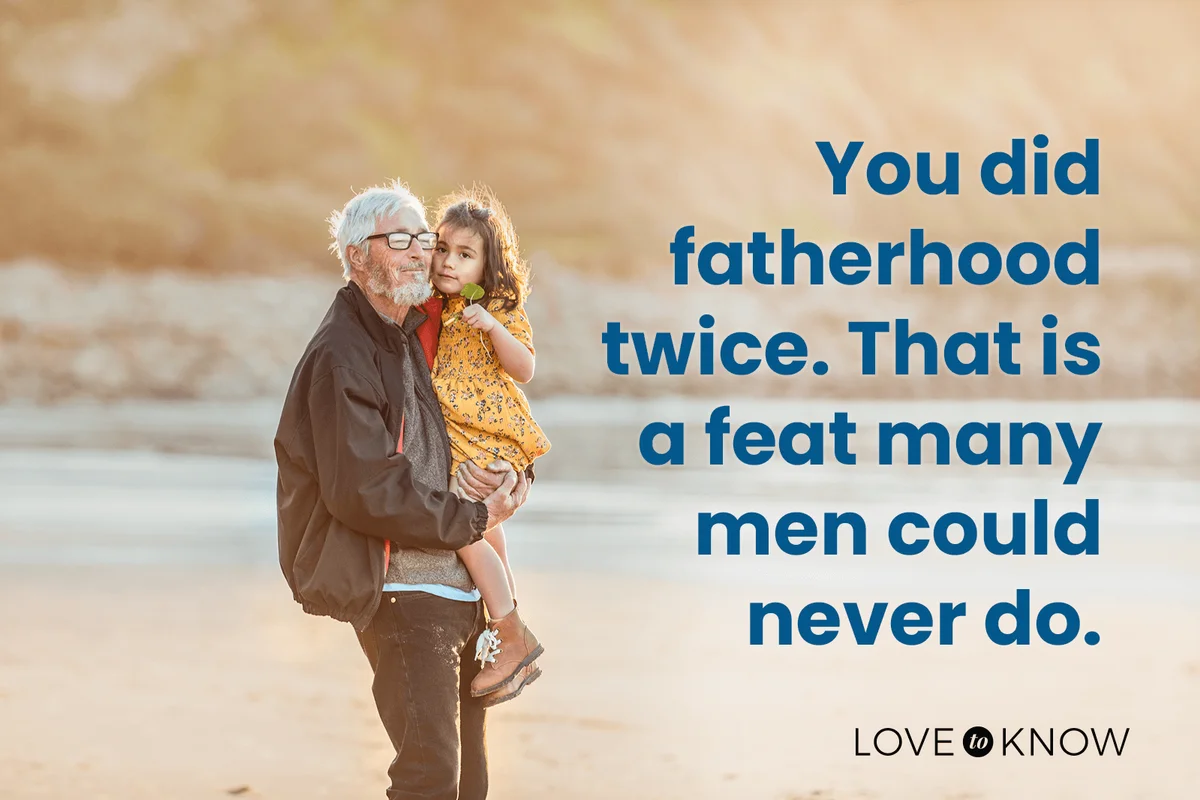 Grandfather Holding Granddaughter At The Beach