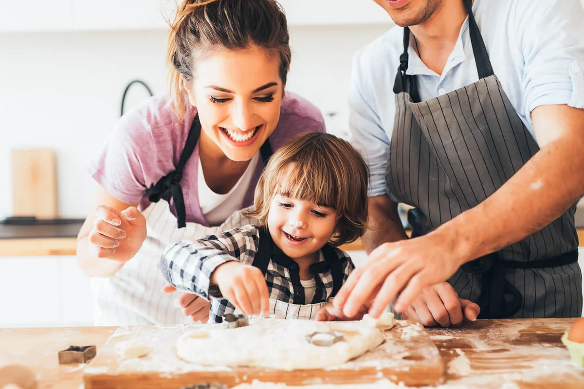 Family making pizza in the kitchen