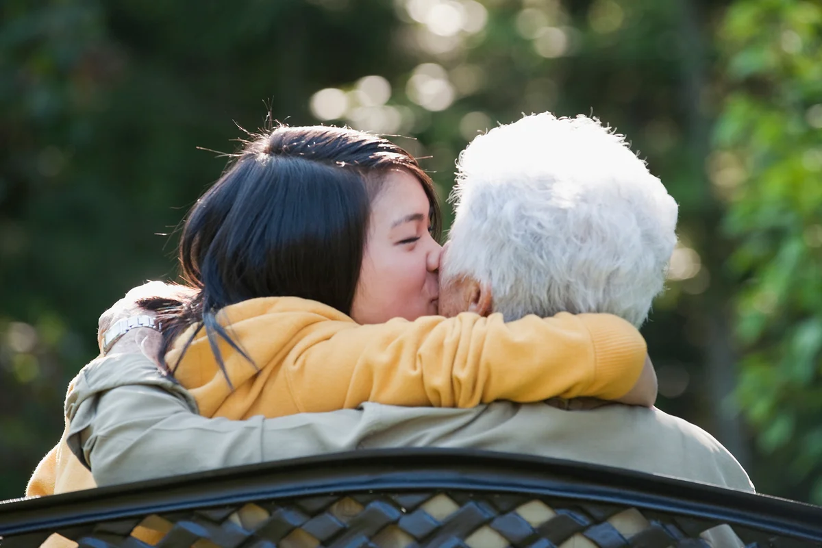 girl kissing grandmother