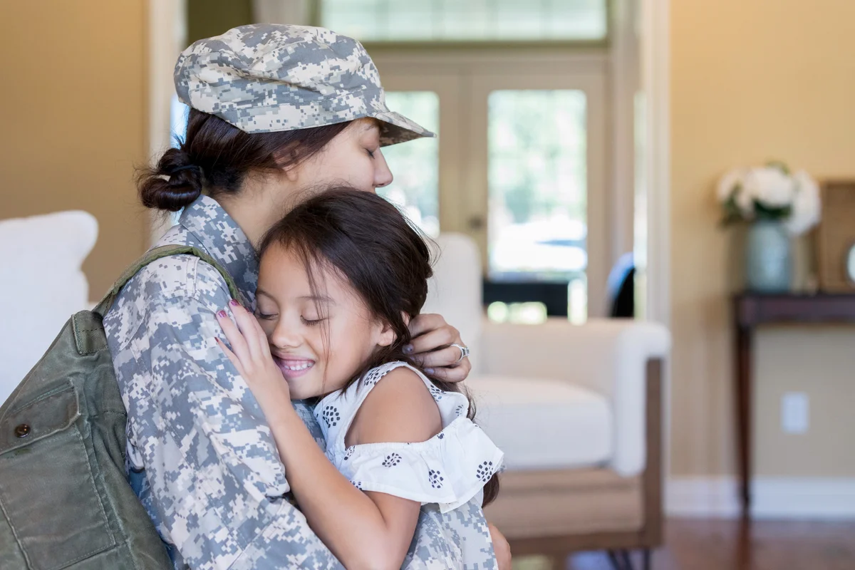 Young girl is happy to see army mom