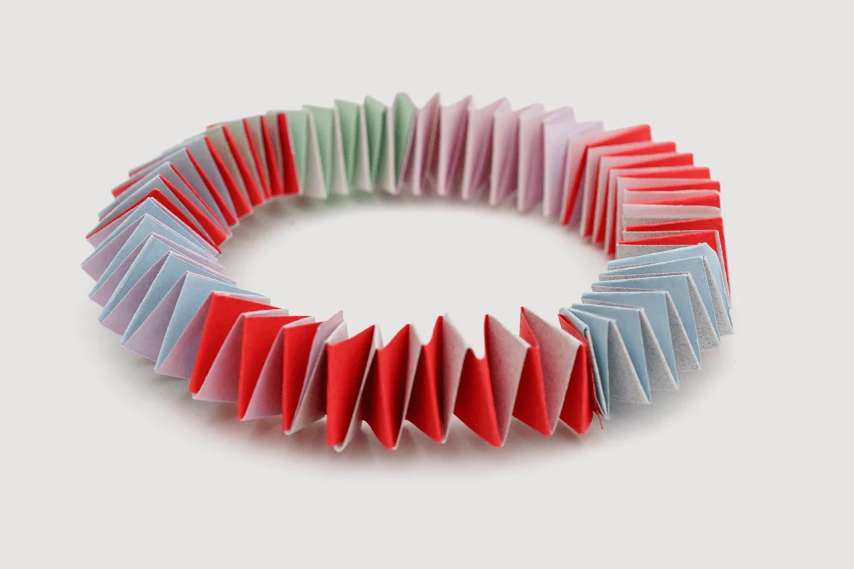 Folding colorful papers with garland origami