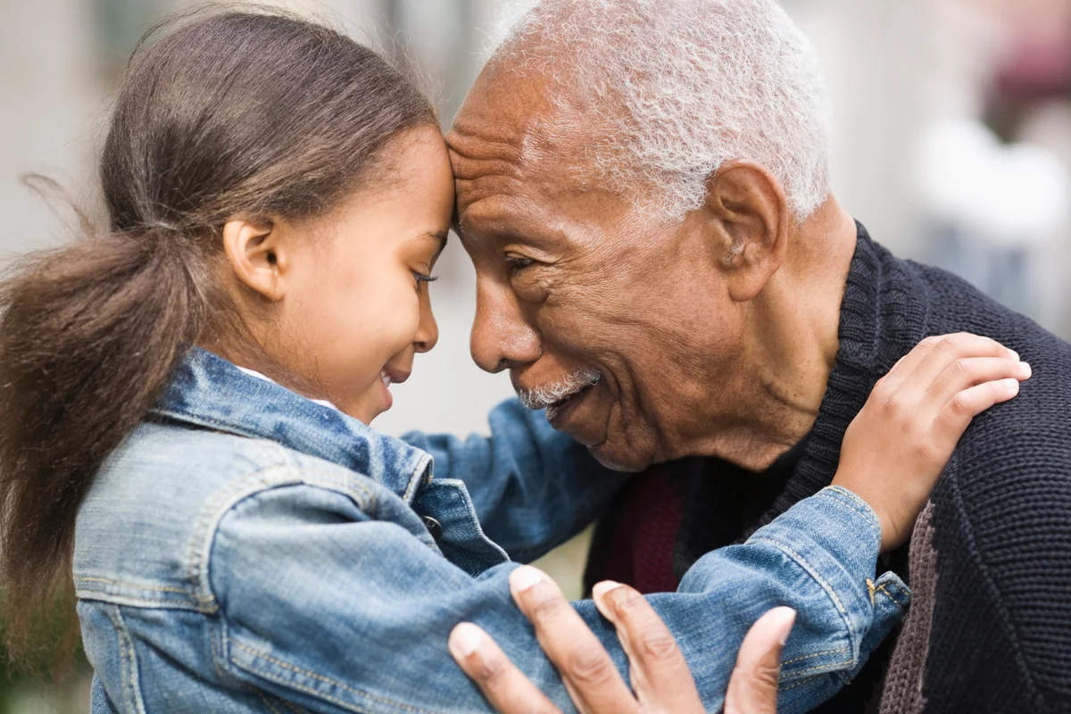 Grandfather and granddaughter face to face
