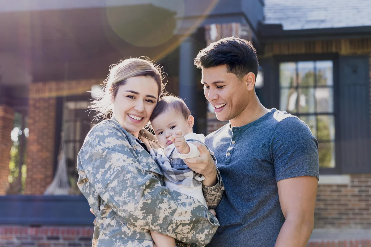 Happy female soldier with her family