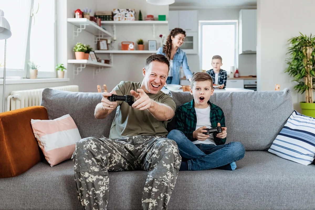 Father in Camouflage Clothes Playing Video Console Game