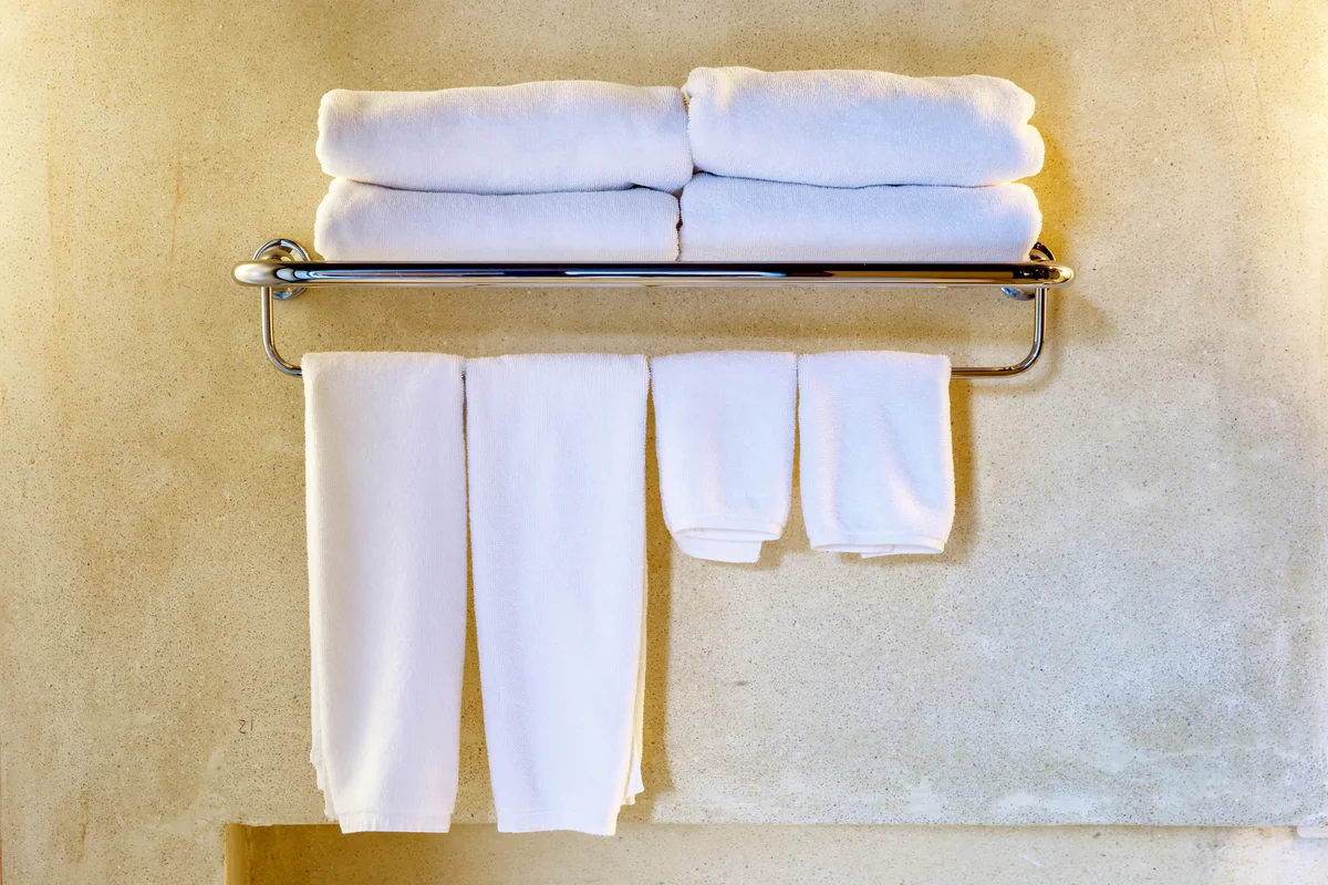 Towels Hanging Against Wall