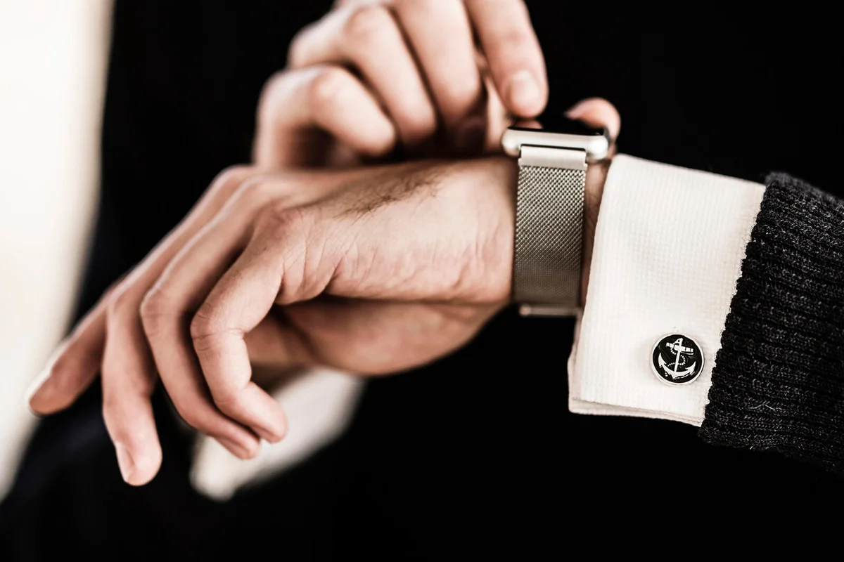 Businessman checking the time on his smartwatch